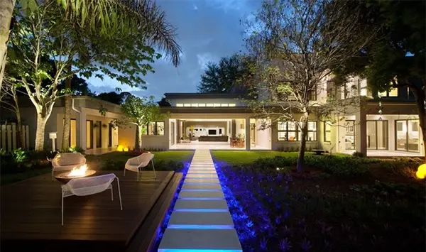 modern front lawn with purple lights