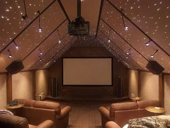 attic media room with starry ceiling