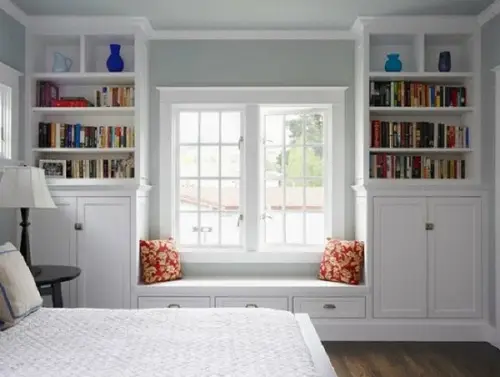 white bedroom with a window seat