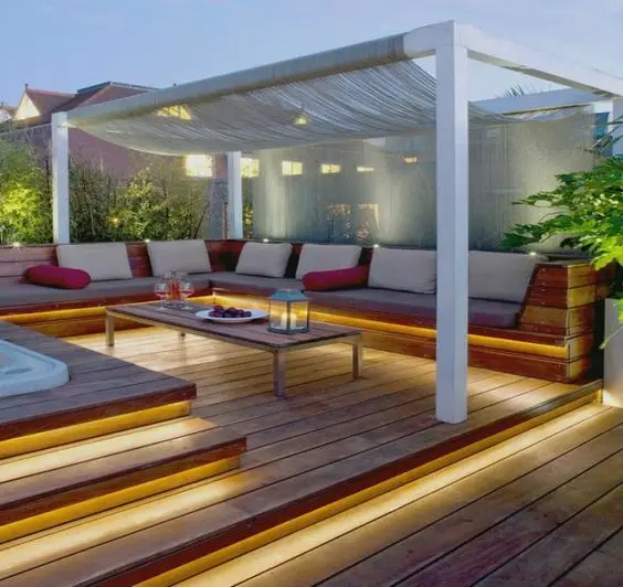 rustic deck pergola with creative lighting