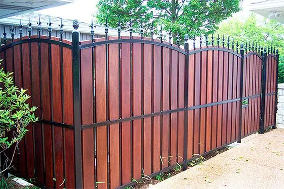 wood and black iron fence