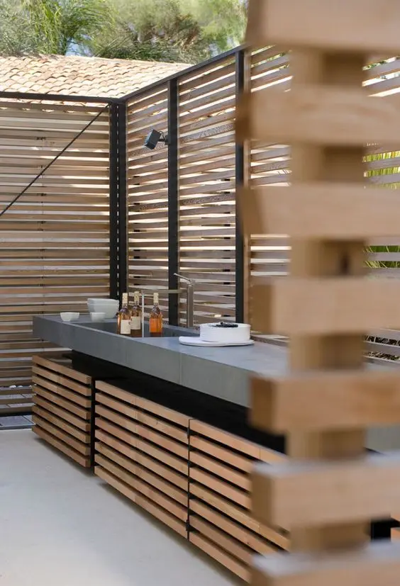 fenced outdoor kitchen