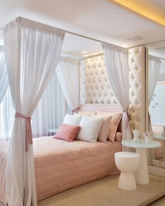 bed with canopy and curtains
