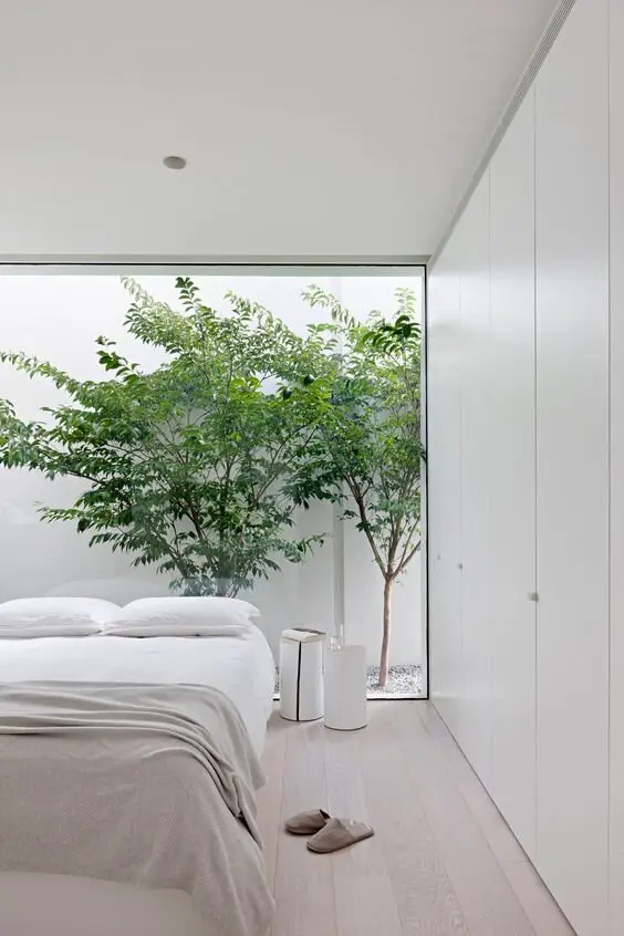 white bedroom with glass wall