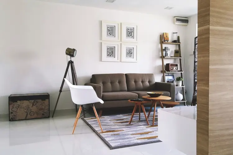 A neutral-toned living room with a sofa and soft furnishings